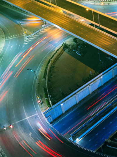 Long exposure of cars traveling on a highway system.